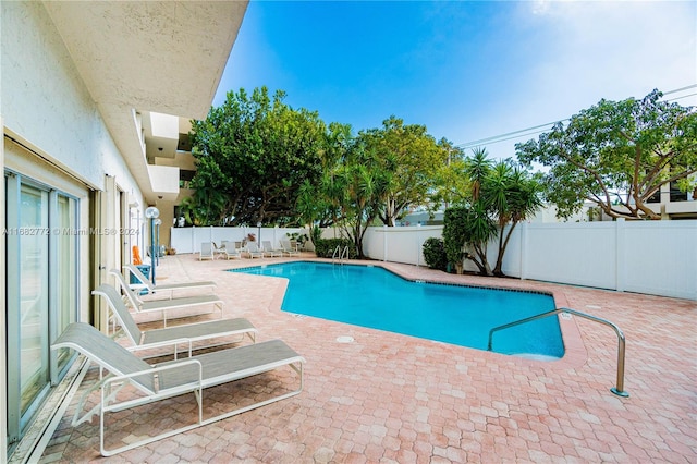 view of pool featuring a patio area