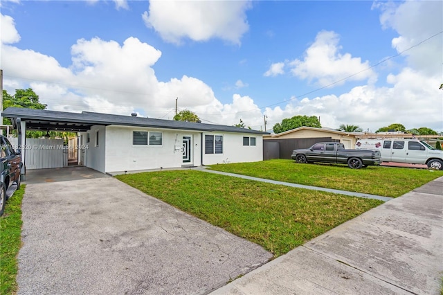 single story home with a carport and a front yard