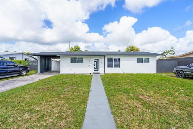 single story home featuring a front yard and a carport