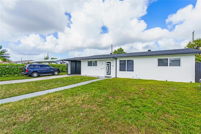 single story home with a front lawn