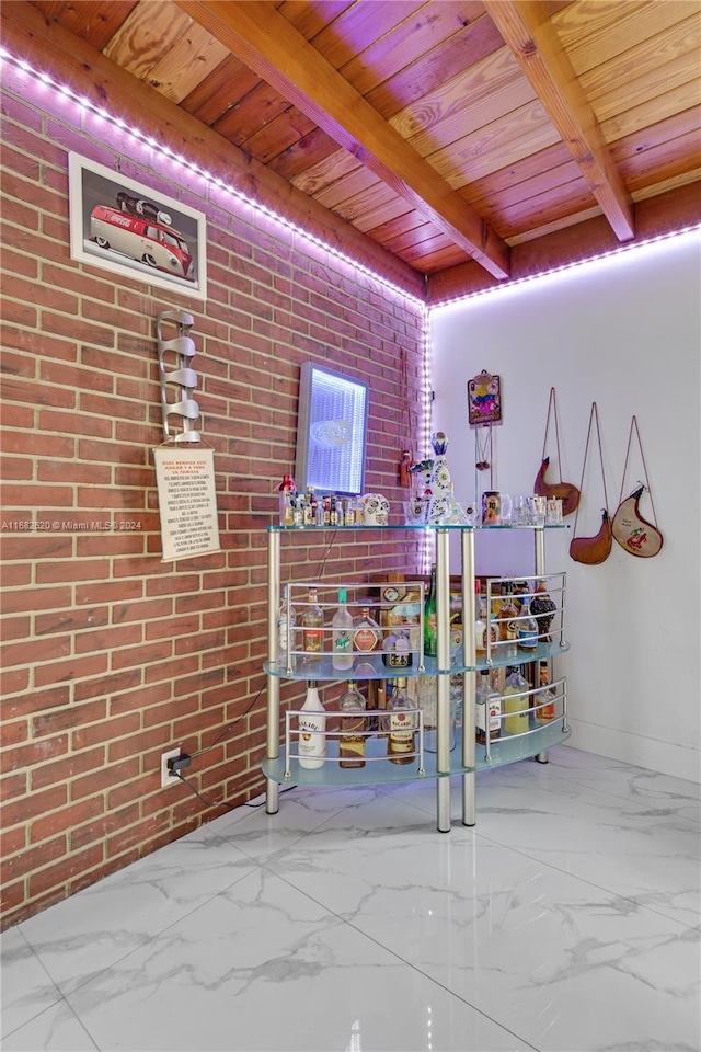 unfurnished living room featuring wood ceiling, brick wall, and beam ceiling