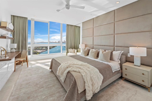 100 S Pointe Dr Unit 3402, Miami Beach, FL 33139 - bedroom with light tile patterned floors, a water view, recessed lighting, and ceiling fan