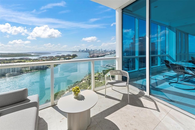 balcony featuring a water view