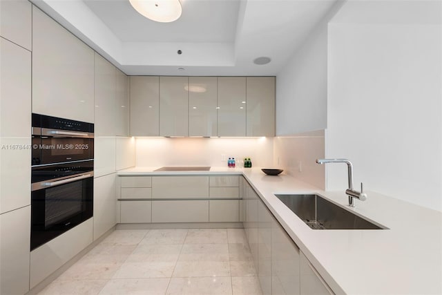 kitchen featuring stovetop and sink