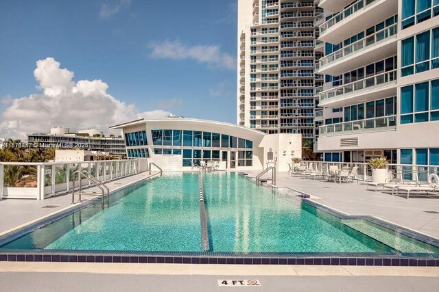100 S Pointe Dr Unit 3402, Miami Beach, FL 33139 - community pool featuring a patio area