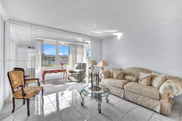 tiled living room with a textured ceiling