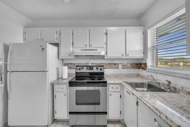 kitchen featuring sink, white cabinetry, stainless steel electric stove, and white refrigerator