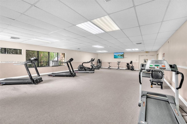 workout area with a paneled ceiling and carpet floors