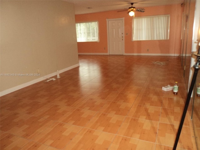 empty room with light hardwood / wood-style flooring and ceiling fan