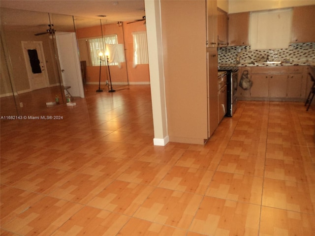 kitchen with stainless steel range oven, decorative light fixtures, tasteful backsplash, and ceiling fan