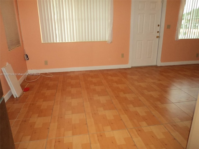 spare room with light hardwood / wood-style flooring