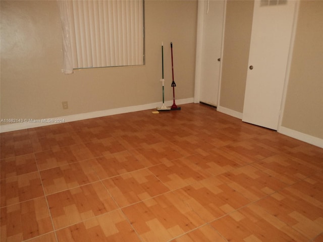 unfurnished room with light hardwood / wood-style flooring