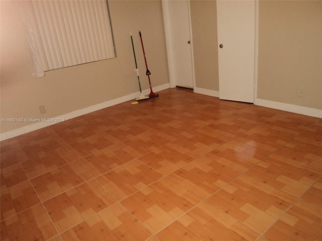 spare room featuring hardwood / wood-style floors