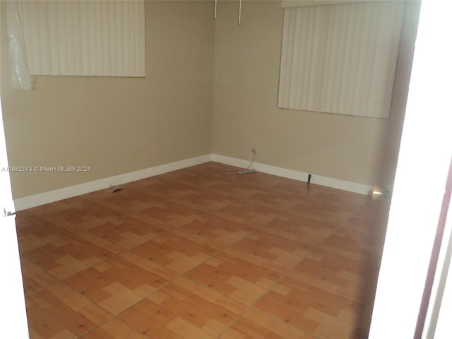 unfurnished room featuring hardwood / wood-style floors