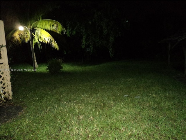 view of yard at twilight