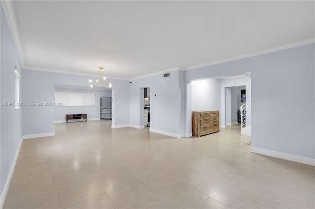 unfurnished living room with a notable chandelier, ornamental molding, and light tile patterned floors