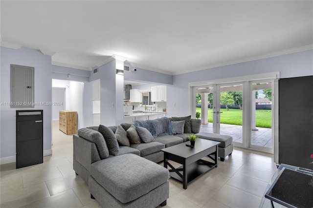 living room with french doors, crown molding, electric panel, and light tile patterned floors