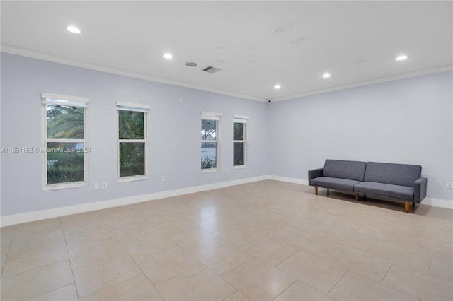 unfurnished room featuring ornamental molding and light tile patterned floors