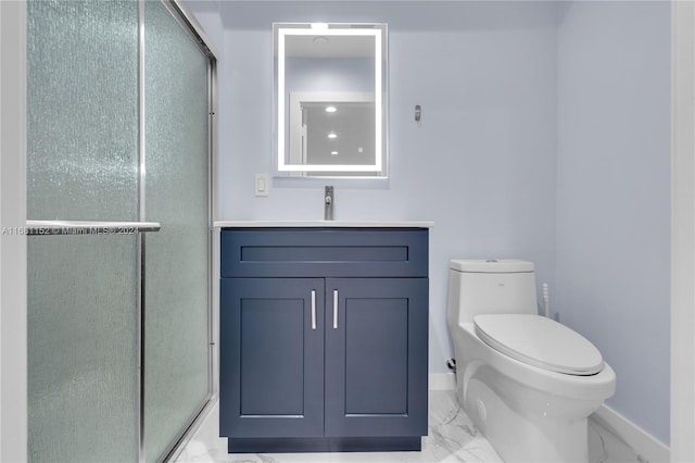 bathroom featuring vanity, toilet, and a shower with door