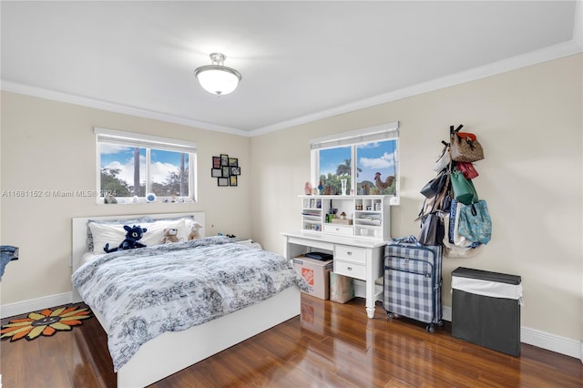 bedroom featuring ornamental molding, multiple windows, and dark hardwood / wood-style floors