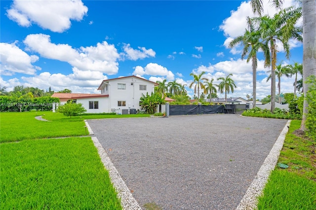 view of home's exterior with a yard