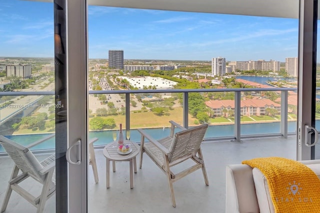 balcony featuring a water view