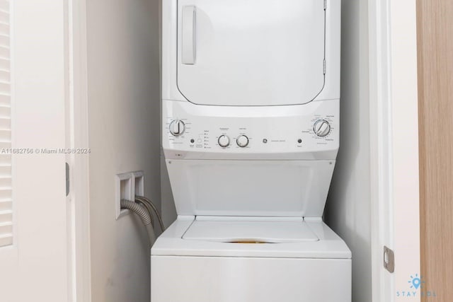 laundry room featuring stacked washer and dryer