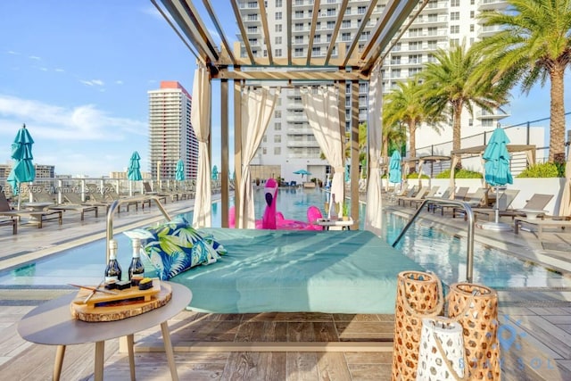 view of pool featuring a patio and a pergola