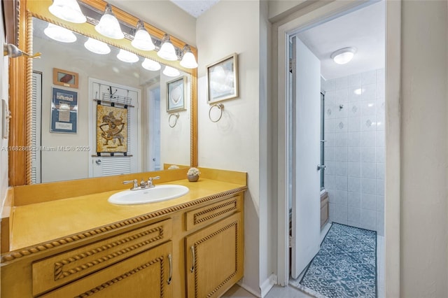 bathroom featuring vanity, a shower, and tile walls