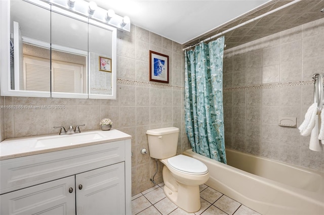 full bathroom with toilet, tile walls, vanity, shower / bath combination with curtain, and tile patterned flooring