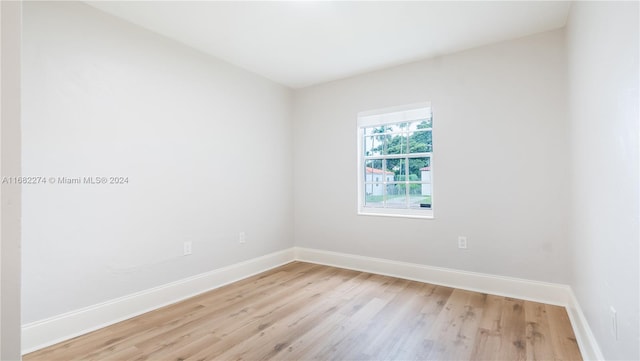 spare room featuring light hardwood / wood-style floors