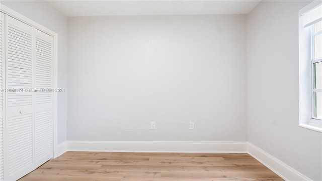 unfurnished room with light hardwood / wood-style flooring