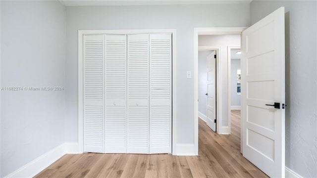 interior space with a closet and light wood-type flooring