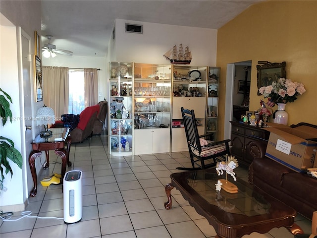 tiled living room featuring ceiling fan