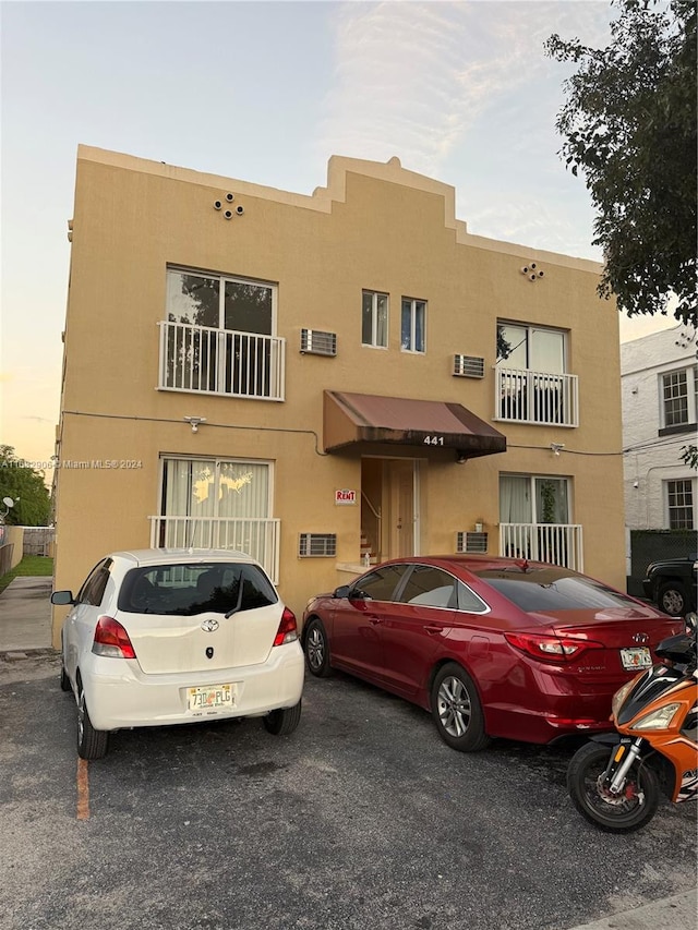 view of front of house featuring a balcony