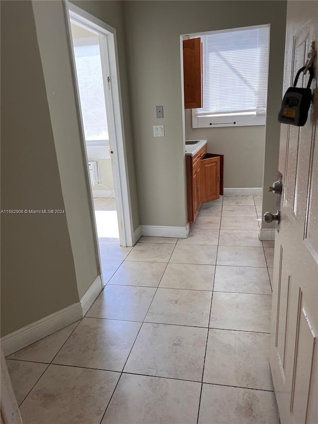 hallway with light tile patterned floors