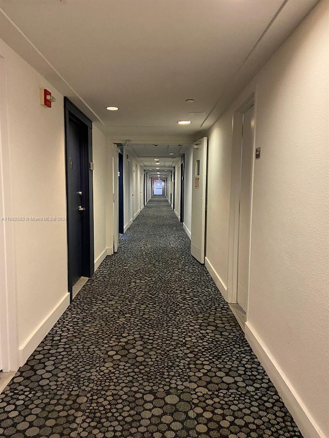 hall featuring carpet