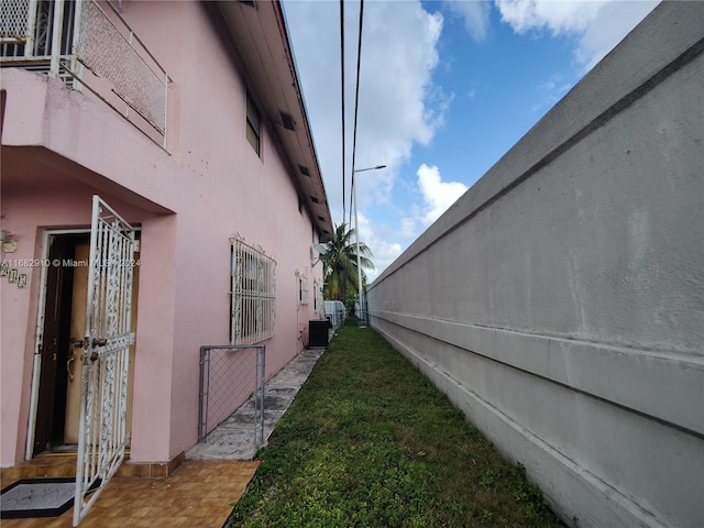 view of side of property featuring central air condition unit