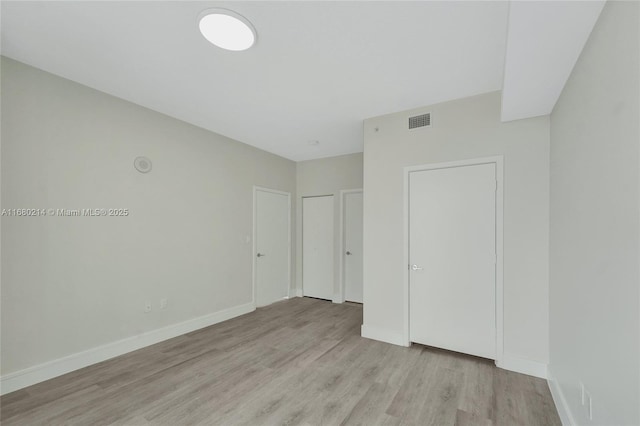 unfurnished bedroom featuring light hardwood / wood-style flooring