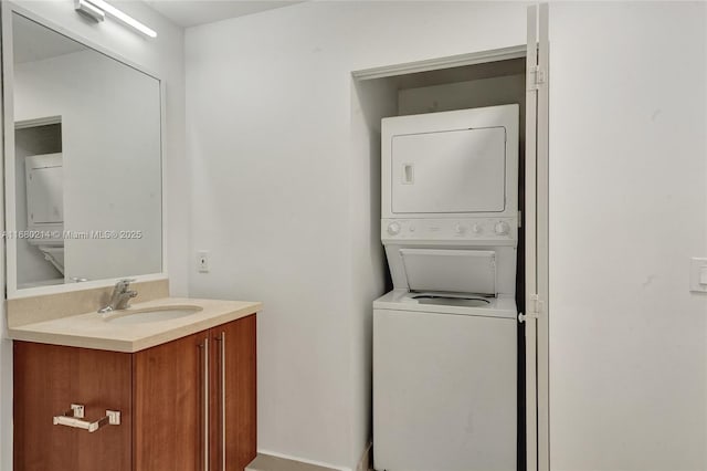 laundry room with stacked washer / dryer and sink