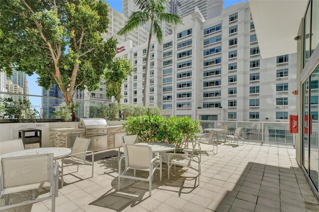 view of patio / terrace featuring an outdoor kitchen and area for grilling