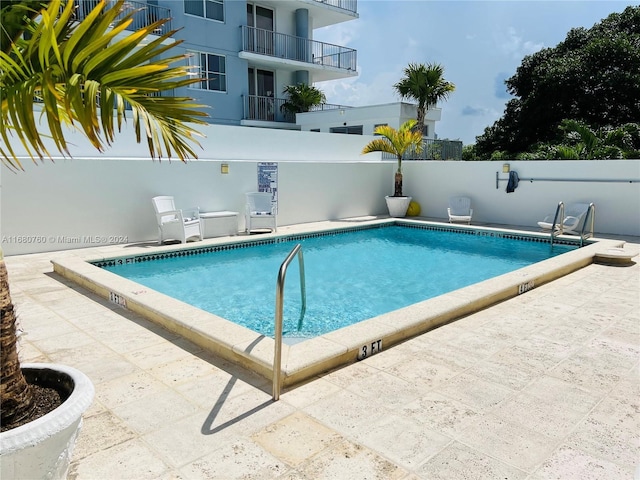 view of pool with a patio