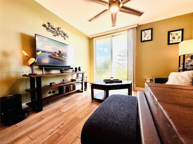 living room with light wood-type flooring and ceiling fan