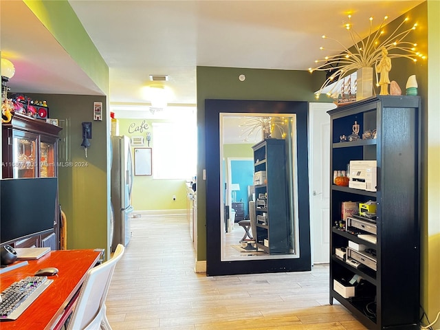 hallway with light wood-type flooring