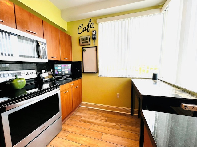 kitchen with light wood-type flooring and stainless steel appliances