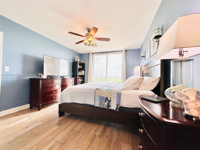 bedroom featuring ceiling fan and light hardwood / wood-style flooring