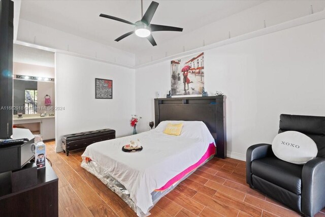 bedroom featuring hardwood / wood-style flooring and ceiling fan