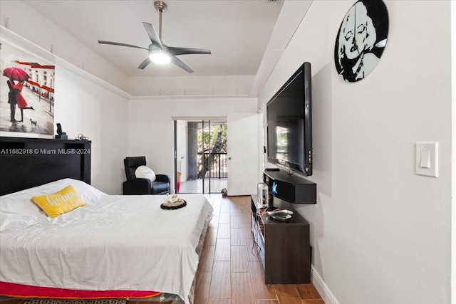 bedroom with ceiling fan, access to outside, and hardwood / wood-style floors