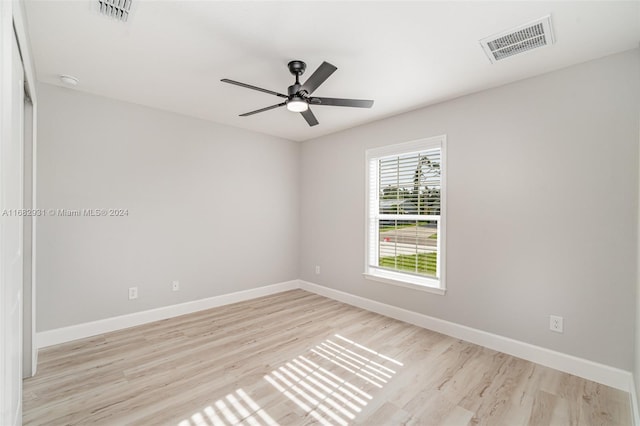 unfurnished room with ceiling fan and light wood-type flooring