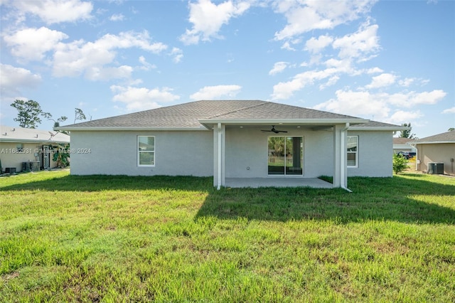 rear view of property with a patio, central AC unit, a lawn, and ceiling fan